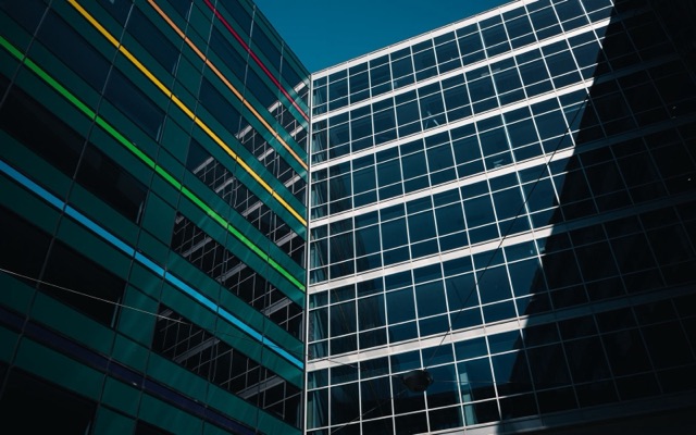 Modern glass buildings against a clear sky