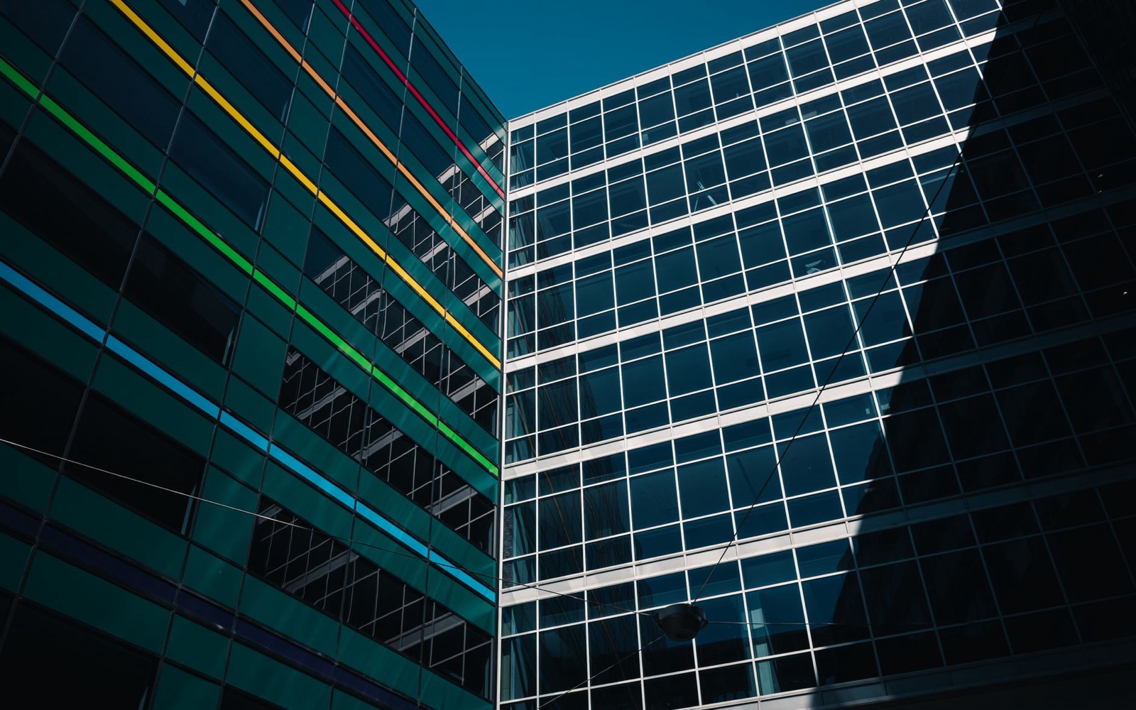 Modern glass buildings against a clear sky