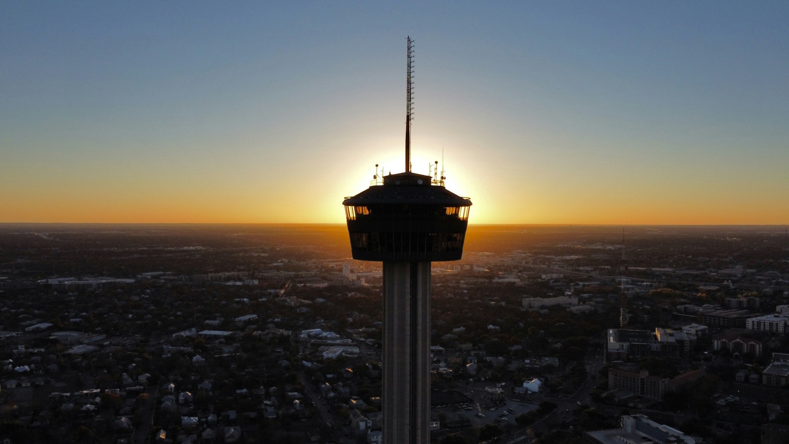 Tower of the Americas rising above San Antonio at sunset